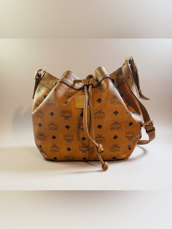 MCM Handbags - MCM Vintage Cognac Visetos Monogram Drawstring Bucket Bag